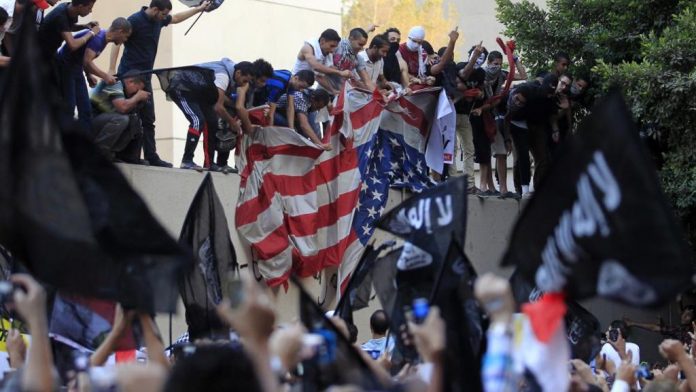 Egyptian Islamist protesters scale US Embassy and replace US Flag