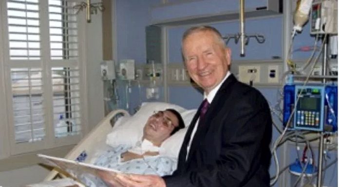 U.S. Army Cpl. Alan Babin Jr. visited by Ross Perot.