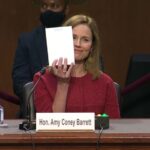 Amy Coney Barrett shows blank notepad.