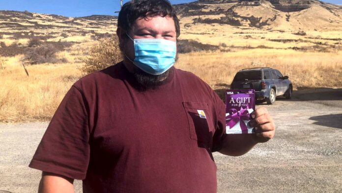 From Facebook: A Nevada voter holding a Voter Project Gift Card.