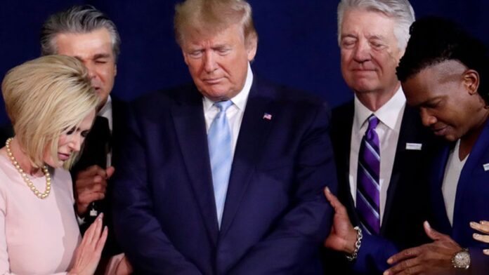 Pastor Paula White, left, and other faith leaders pray with President Donald Trump Pastor Paula White, left, and other faith leaders pray with President Donald Trump
