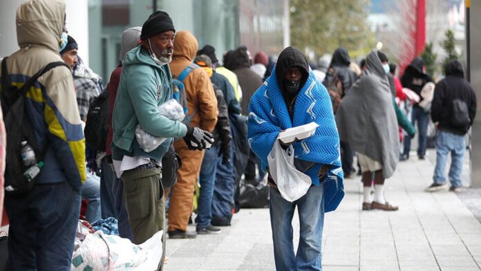 More than 200 people outside the George R. Brown Convention Center, in Houston, Sunday, Feb. 14, 2021, More than 200 people outside the George R. Brown Convention Center, in Houston, Sunday, Feb. 14, 2021,