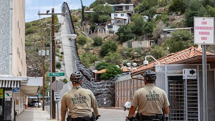 Border Patrol agents patrol the border in Nogales, Arizona