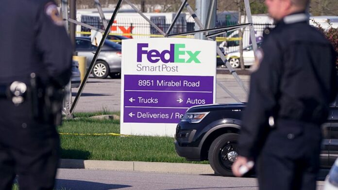 Police stand near the scene where multiple people were shot at the FedEx Ground facility Police stand near the scene where multiple people were shot at the FedEx Ground facility