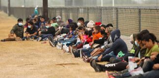 Illegal immigrants wait for Border Patrol