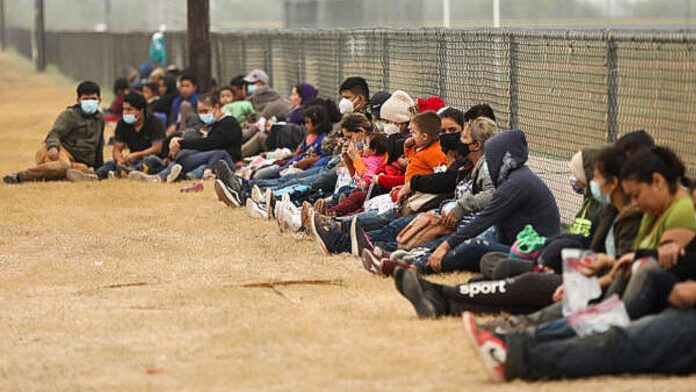 Illegal immigrants wait for Border Patrol