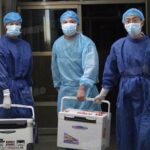 Doctors carry fresh organs for transplant at a hospital in Henan province, China, on Aug. 16, 2012.