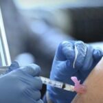 UCI medical staff receives a COVID-19 vaccination