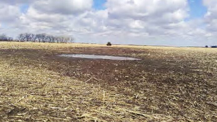 A mud puddle located on the farm of Arlen and Cindy Foster