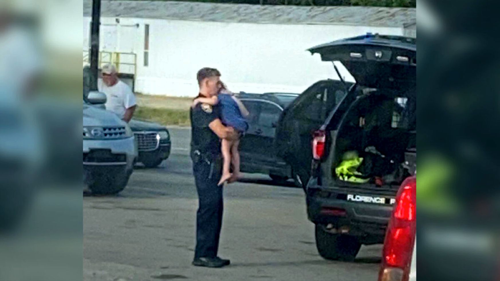 Alabama Police Office Comforting Child