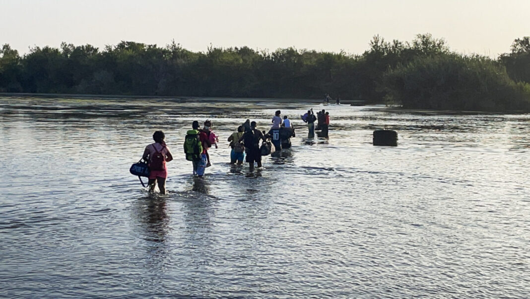 Illegal immigrants cross Rio Grande from Acuna, Mexico, to Del Rio, TX