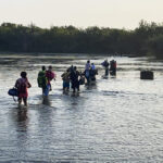 Illegal immigrants cross Rio Grande from Acuna, Mexico, to Del Rio, TX