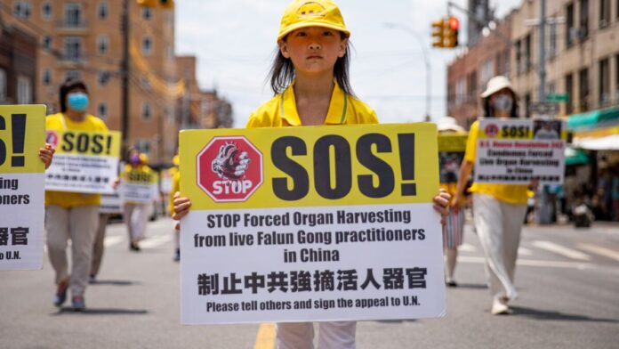 Falun Gong practitioners take part in a parade