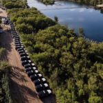 Steel barrier' of hundreds of state trooper SUVs line the border in Texas
