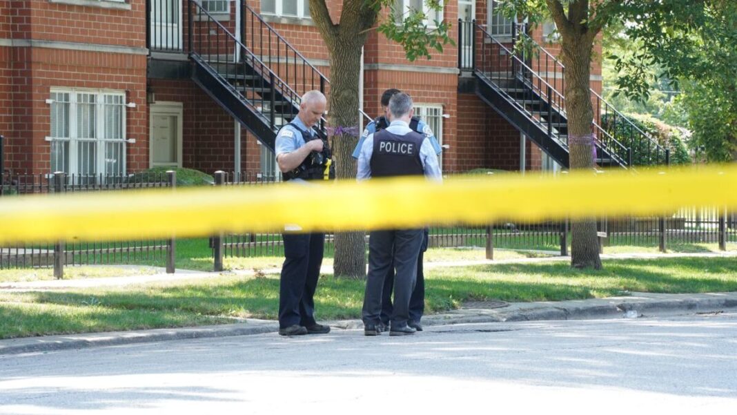 Police officers talk with detective in Chicago