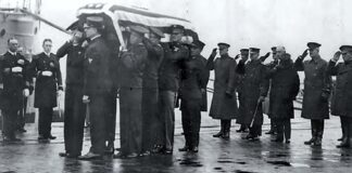 Body bearers carry the unknown Soldier from the USS Olympia