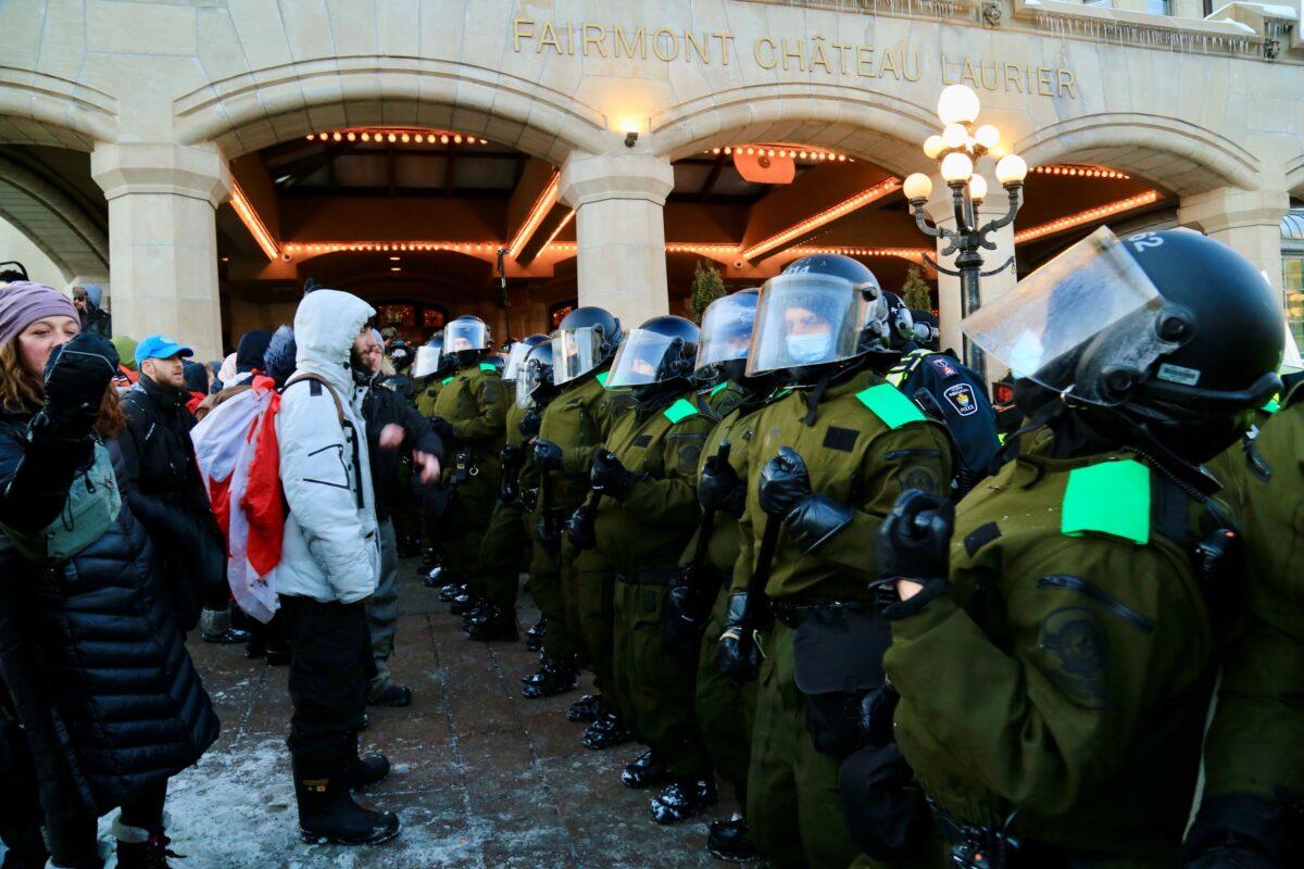 Police confront protesters in Ottawa on Feb. 18, 2022.