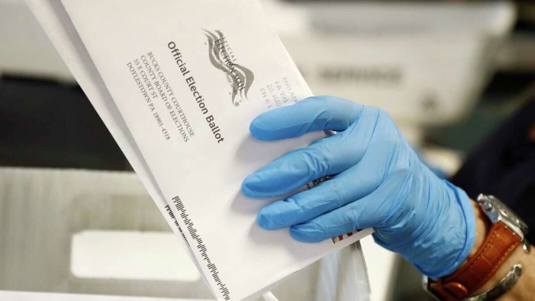 Worker processes mail-in ballots at the Bucks County Board of Elections office.