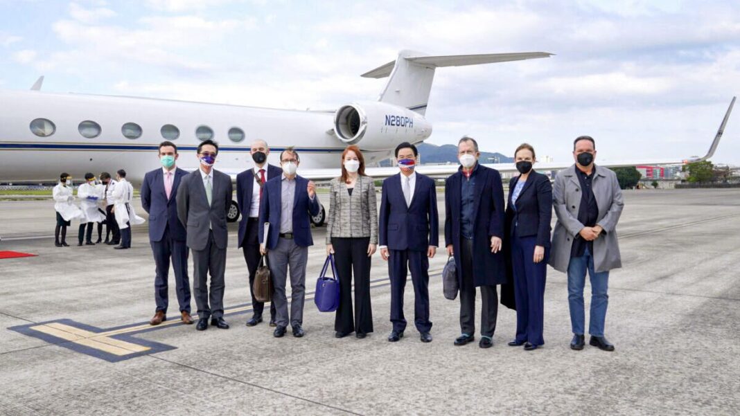 Taiwan's Foreign Minister Joseph Wu (4th R) stands with a U.S. delegation including retired Admiral Mike Mullen (3rd R), former chair of the Joint Chiefs of Staff, as they arrive at Taipei Songshan Airport in Taiwan on March 1, 2022.