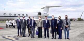 Taiwan's Foreign Minister Joseph Wu (4th R) stands with a U.S. delegation including retired Admiral Mike Mullen (3rd R), former chair of the Joint Chiefs of Staff, as they arrive at Taipei Songshan Airport in Taiwan on March 1, 2022.
