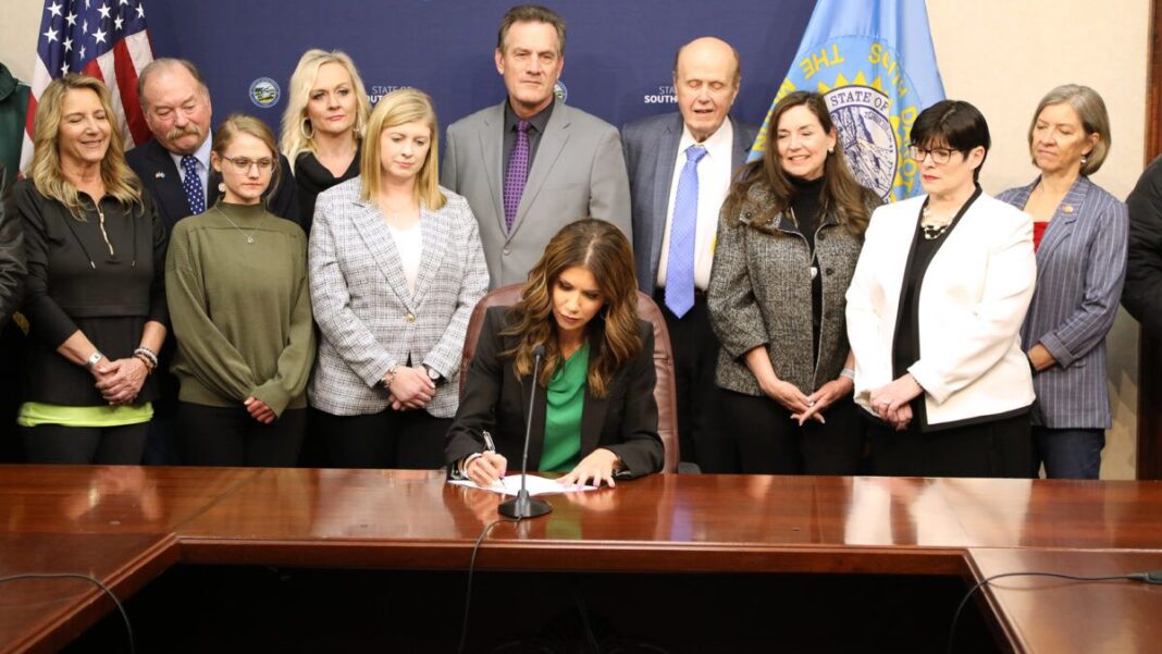 South Dakota Gov. Kristi Noem signs a elections bill