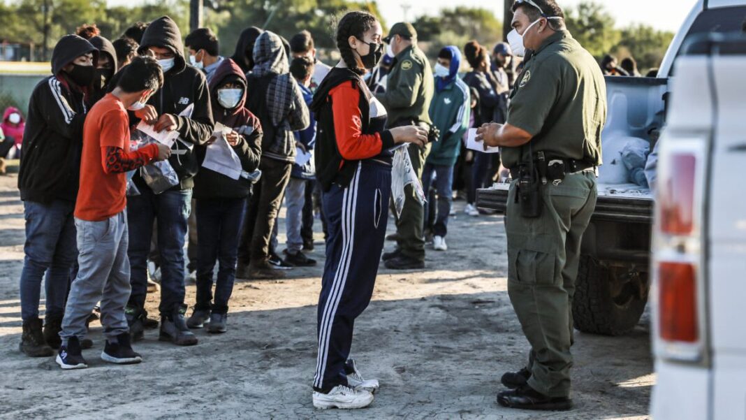 Border Patrol agents apprehend and transport illegal immigrants