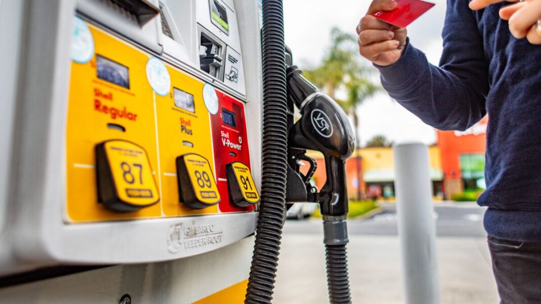 A man pumps gas