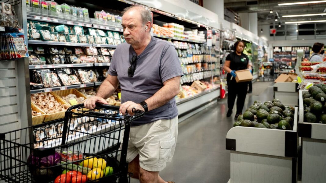 People shop at a grocery store in New York City