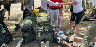 Border Patrol agents provide medical assistance to an illegal immigrant