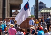 Camp Constitutions' Christian flag was hoisted over Boston City Hall