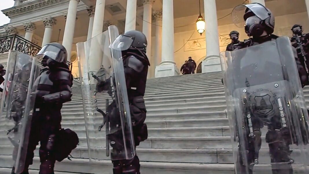 U.S. Capitol Police guard the steps leading to the Columbus Doors