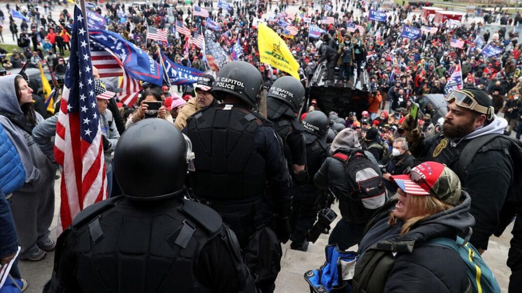 Capitol Police being escorted down the Capitol steps