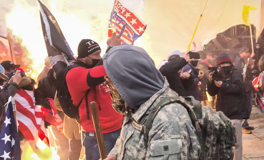 A munition detonates at protesters' feet on the west front of the U.S. Capitol on Jan. 6, 2021.