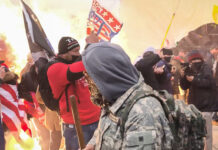 A munition detonates at protesters' feet on the west front of the U.S. Capitol on Jan. 6, 2021.