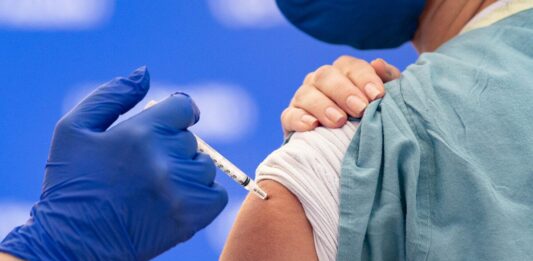 Nurse Receives COVID-19 Vaccine