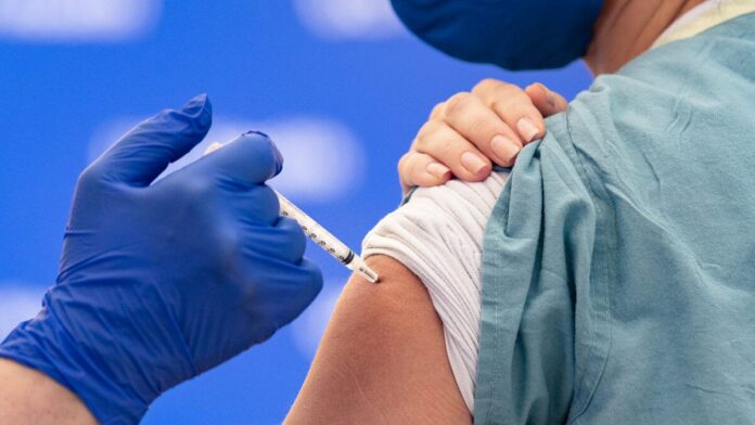 Nurse Receives COVID-19 Vaccine Nurse Receives COVID-19 Vaccine