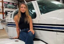 Pilot Sierra Lund is pictured with a small airplane in 2022.