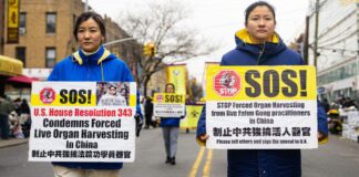 Falun Gong practitioners walk in a parade in Brooklyn, N.Y.