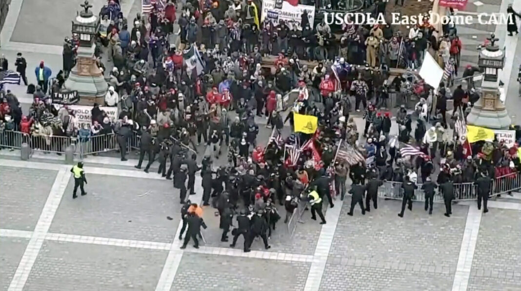 A Capitol Police security camera captures the breach of barricades on the Capitol's east side on Jan. 6, 2021.