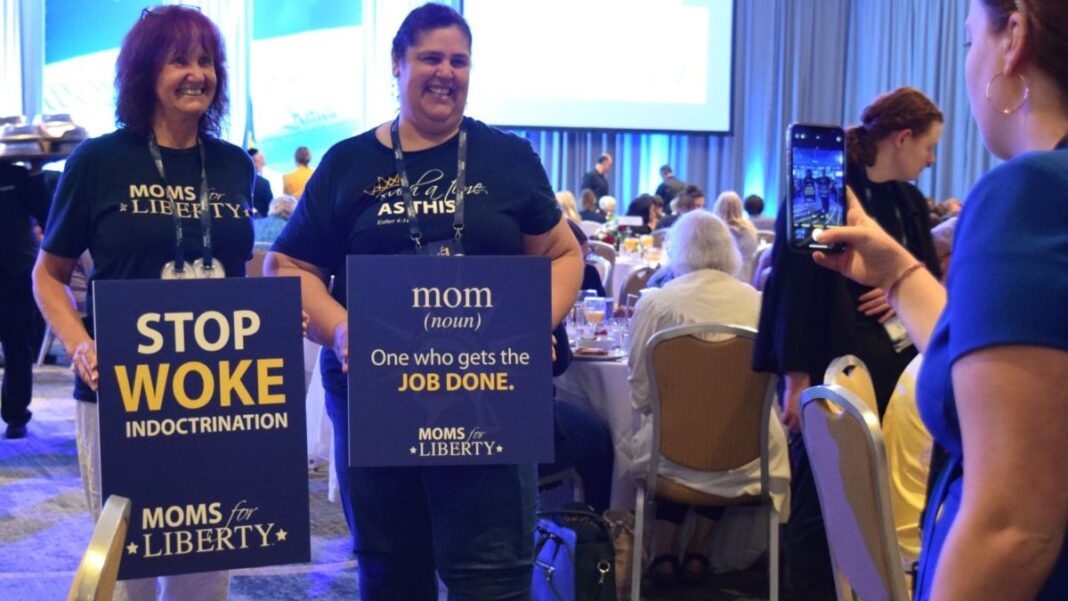 Two attendees at the Moms for Liberty national summit in Philadelphia