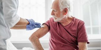 Elderly man gets vaccinated for COVID-19