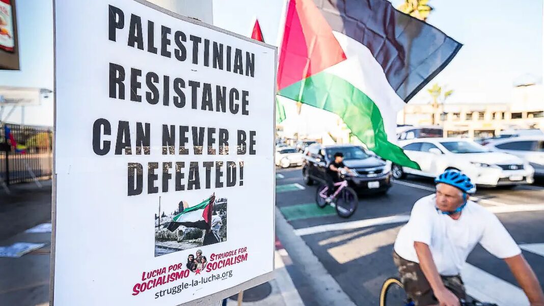 Protesters wave Palestinian flags in support of Palestinians and socialism in Los Angeles on Oct. 12, 2023.
