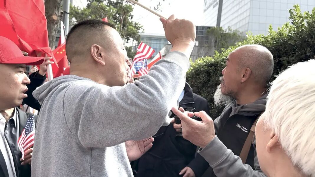 Pro-China protesters clash with Chinese dissidents in front of the St. Regis hotel in San Francisco on Nov. 14, 2023.