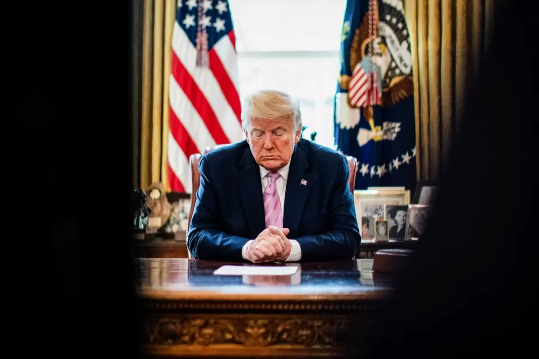 Trump bows his head during an Easter blessing