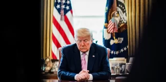 Trump bows his head during an Easter blessing