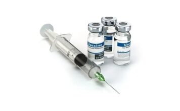 Vaccine Bottles and Syringe