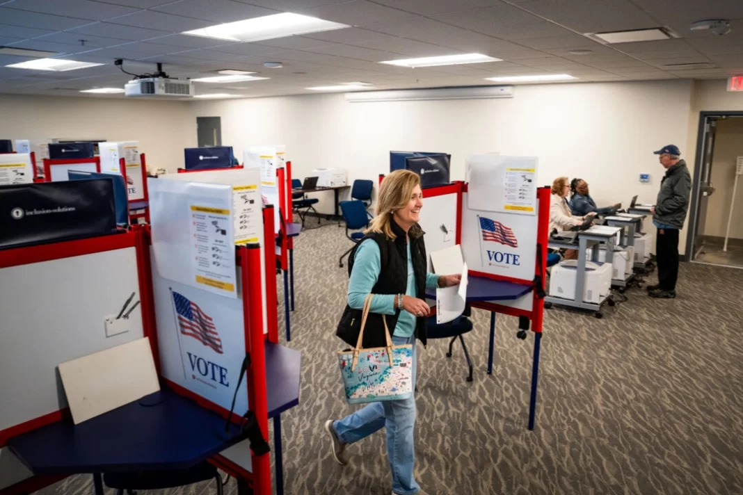 Shannon Ridgley, a government worker in Loudoun County, casts her vote for Trump in the Republican primary in Leesburg, Va., on March 2, 2024.