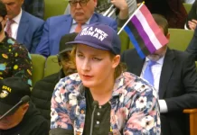A transgender activist speaks in support of Sacramento’s trans sanctuary city resolution at city hall on March 26, 2024.