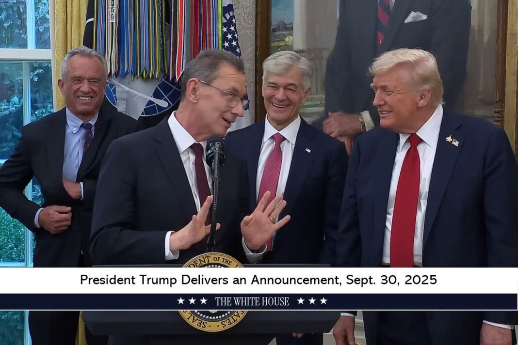 Pfizer CEO Albert Bourla speaks to President Donald Trump in Washington on Sept. 30, 2025.