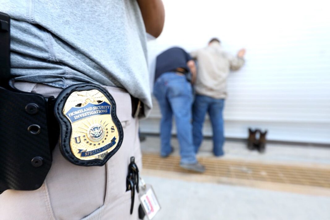 ICE agents execute a federal criminal search warrant at a business in north Texas on Aug. 28, 2018.